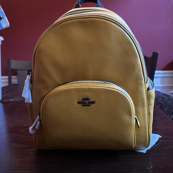 Coach yellow / gold (ochre) Court backpack.Brand new w/tags.